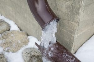 Frozen water in the rainwater drain pipe.