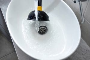 Clogged sink in house - unclog the blockage with sink plunger.